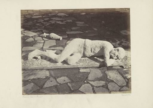 Cast of a man who died in a volcanic eruption with an amphora in Pompeii