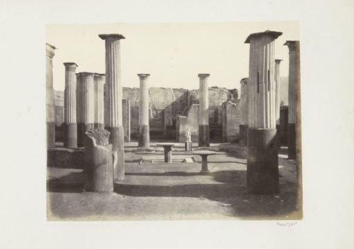 Remains of buildings with a statue in Pompeii