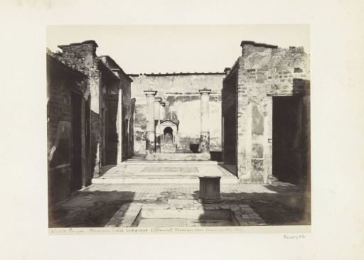 Remains of the House of the Tragic Poet in Pompeii, with a mosaic in the centre