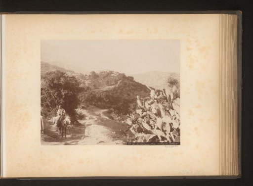 Man on horseback in a mountain landscape