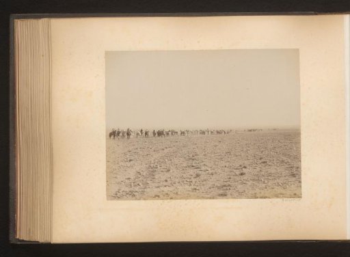 View of a caravan through the desert