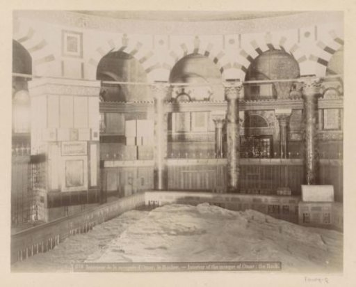 Interior of the Dome of the Rock Mosque on the Temple Mount in Jerusalem with the rock in the foreground