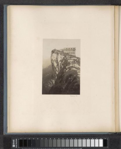 House on a rock face, probably in the Alps between Germany and Austria