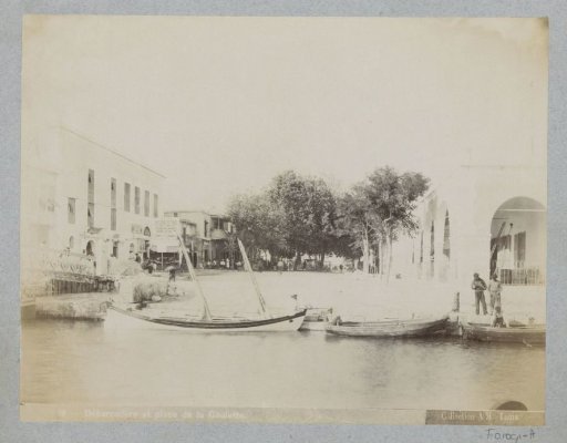 Quay with ships and a grocer's shop in Tunis