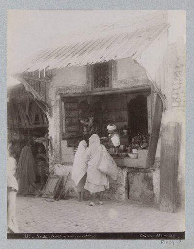 Customers at a shop in the souk of Tunis