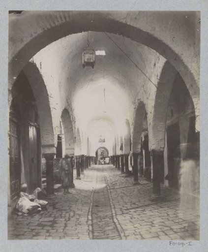 Arcade with reclining figures in the souk of Tunis
