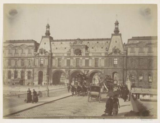 Pedestrians and horse-drawn carriages at the gates of the Louvre in Paris