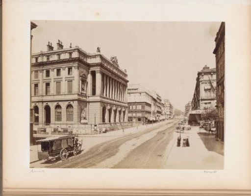 La Canebière in Marseille with the Palais de la Bourse on the left and a horse-drawn carriage