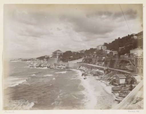 View of the coast near Marseille with boats, buildings and a road
