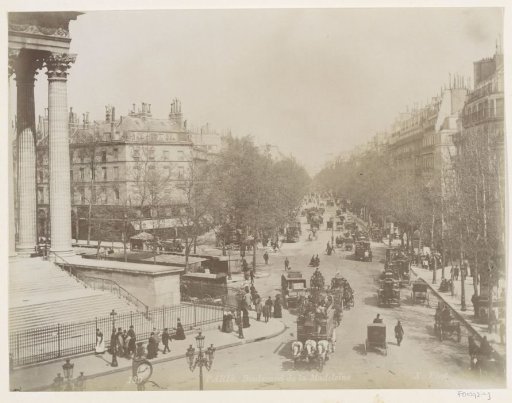 Boulevard de la Madeleine in Paris with pedestrians, horse-drawn carriages and a horse-drawn tram