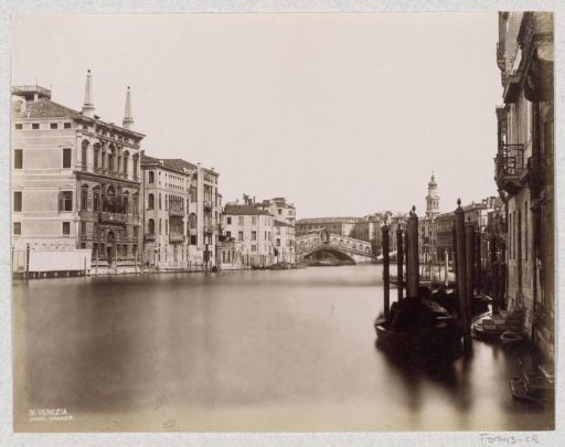 Houses on the Grand Canal in Venice and in the background the Rialto Bridge