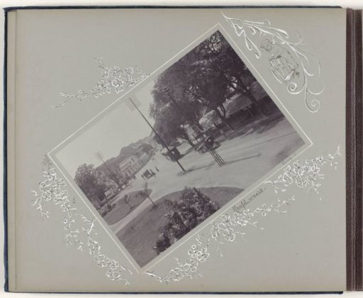 Street view in Surabaya with tram, carts and passers-by