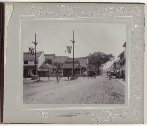 Street view at the Chinese Church in Surabaya with carriages and passers-by