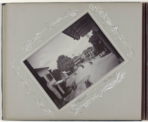 Street view at the Willemskade in Surabaya with carts and passers-by