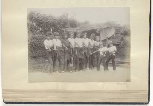 Group of boys with right arm extended, possibly dancers