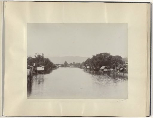 River with stilt houses in the Dutch East Indies