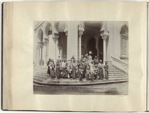 Group portrait of women and children on the steps of the Great Mosque of Banda Aceh