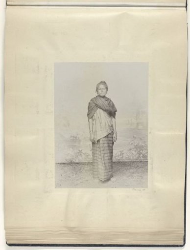 Portrait of an Indonesian woman in front of a backdrop