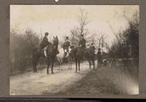 Equestrian scene at the Royal Gamekeeper's Lodge Het Loo: riders with a pack of hounds on a country road