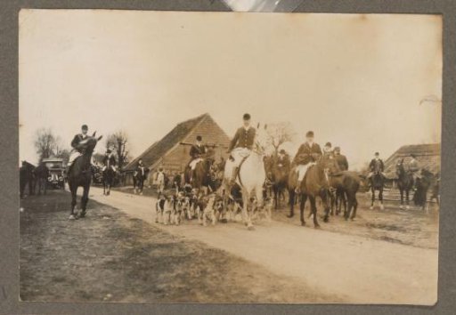 Equestrian scene at the Royal Gamekeeper's Lodge Het Loo: riders with a pack of hounds on a country road