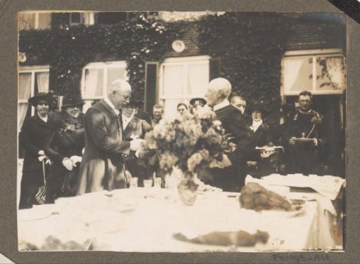 Equestrian scene at the Royal Gamekeeper's Lodge Het Loo: company in a garden at a set table, possibly at a festive occasion