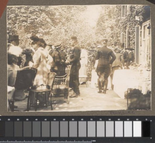 Equestrian scene at the Royal Gamekeeper's Lodge Het Loo: company at set tables in a garden
