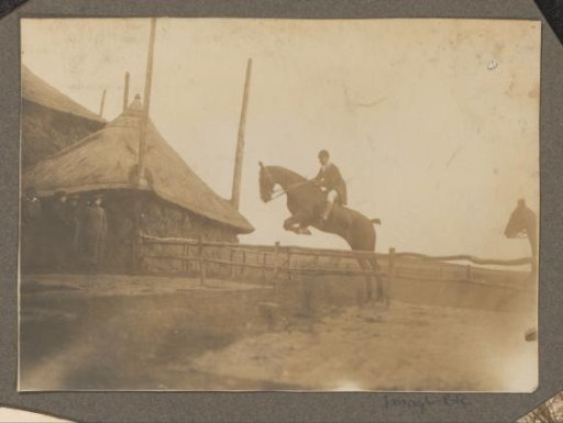 Equestrian scene at the Royal Game Preserve Het Loo: rider taking an obstacle at a haystack