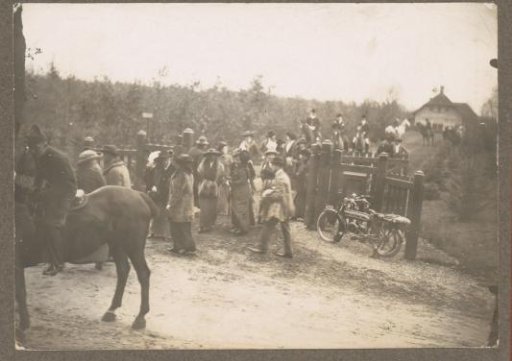 Equestrian scene at the Royal Game Preserve Het Loo: riders with public at a fence and a motorcycle