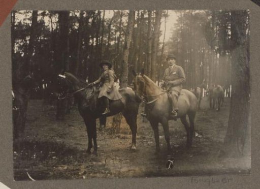 Equestrian scene at the Royal Game Preserve Het Loo: girl and man on horseback in a forest