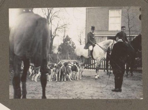 Equestrian scene at the Royal Game Preserve Het Loo: riders with pack of hounds at a country house