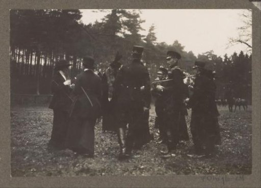 Equestrian scene at the Royal Game Preserve Het Loo: group of riders by a forest