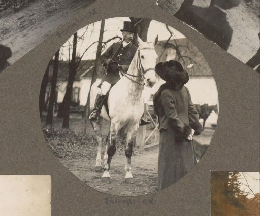 Equestrian scene at the Royal Woodlands of Het Loo: woman standing beside a rider