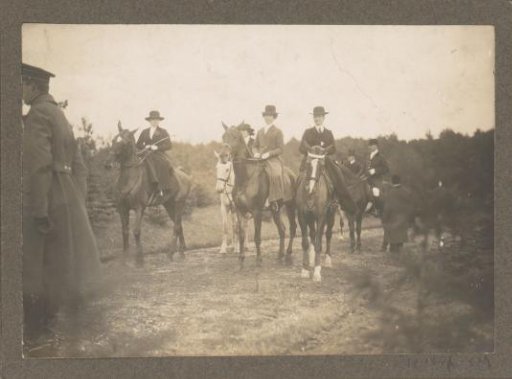 Equestrian scene at the Royal Woodlands of Het Loo: riders including women in riding habit on a country road