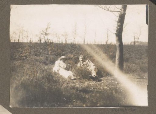 Equestrian scene at the Royal Woodlands of Het Loo: man and woman lying on a heath