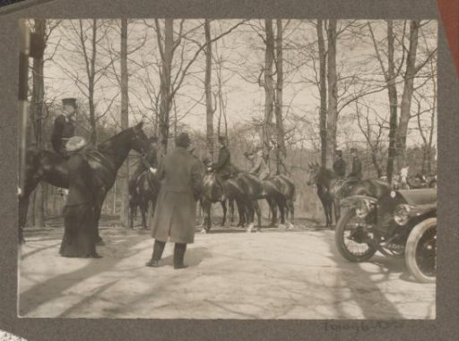 Equestrian scene at the Royal Woodlands of Het Loo: riders, public and a car (Berliet) on a road