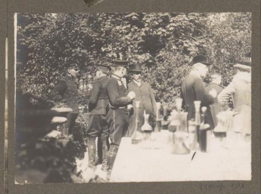 Equestrian scene at the Royal Woodlands of Het Loo: company at a set table outdoors