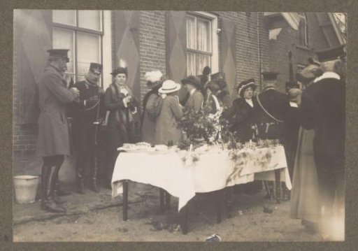 Equestrian scene at the Royal Forest Management Het Loo: group at set tables by a house