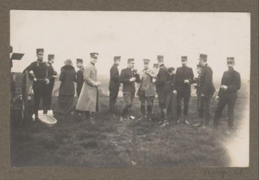Equestrian scene at the Royal Forest Management Het Loo: riders and uniformed men eating and drinking on a heath