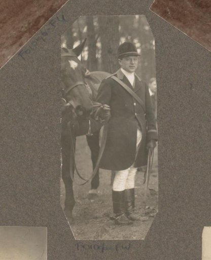 Equestrian scene at the Royal Forestry Department Het Loo: rider standing next to a horse