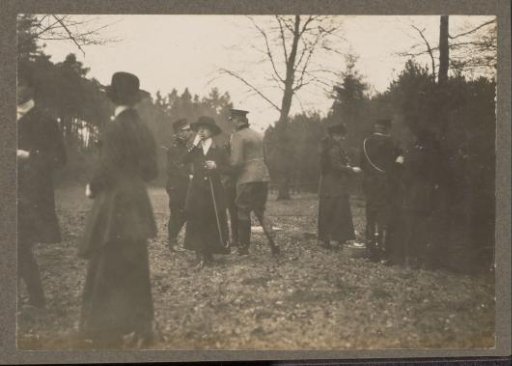 Equestrian scene at the Royal Forestry Department Het Loo: riders in a forest with a woman smoking a cigarette