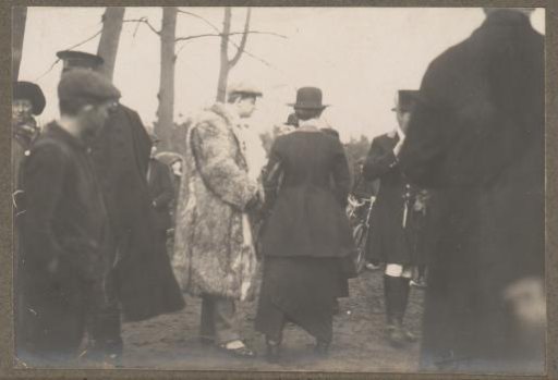 Equestrian scene at the Royal Forest Estate Het Loo: public including a man in a fur coat
