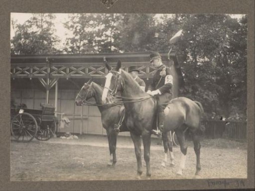 Equestrian scene at the Royal Forestry Het Loo: two riders, one uniformed, near a wooden building