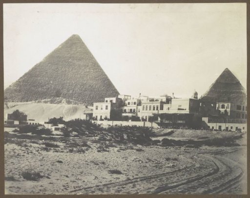 View of the Pyramids of Giza with the Mena House Hotel in front