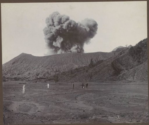Presumably Dutch group on a plain near a smoking volcano in the Dutch East Indies