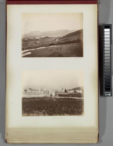 View of a walled town with a gate, possibly Tétouan