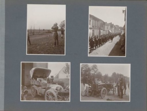Soldiers marching through a village in France
