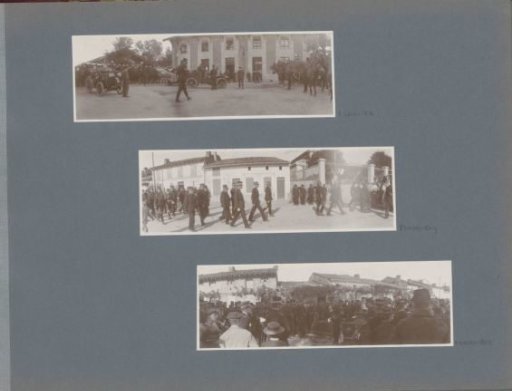 Soldiers on horseback and in cars in front of a building in France