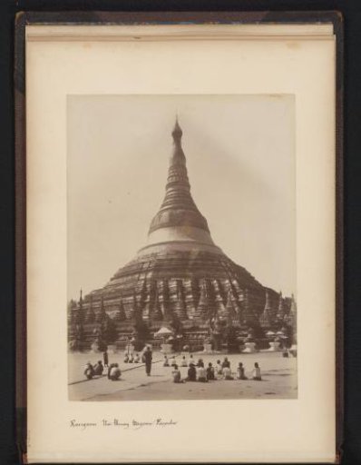 Shwedagon Pagoda with praying people at the foreground, Yangon, Myanmar