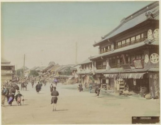 Street in Yokohama with passers-by, shops and houses