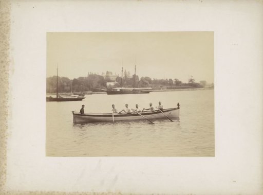 Six men in a rowing boat along the coast, probably near Sydney